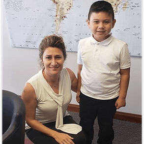 Emel Ersan with a child she helped